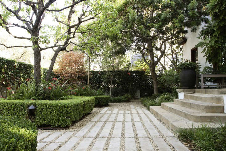 A front path of flagstone was replaced by concrete pavers. 