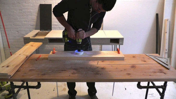 Diy Hanging Garden Shelves For A Small Space Gardenista Above After Drilling Pilot Holes As Guides Ben Cut For The Pots Using A Hole Saw Be Sure To Clamp Board Work Surface Before