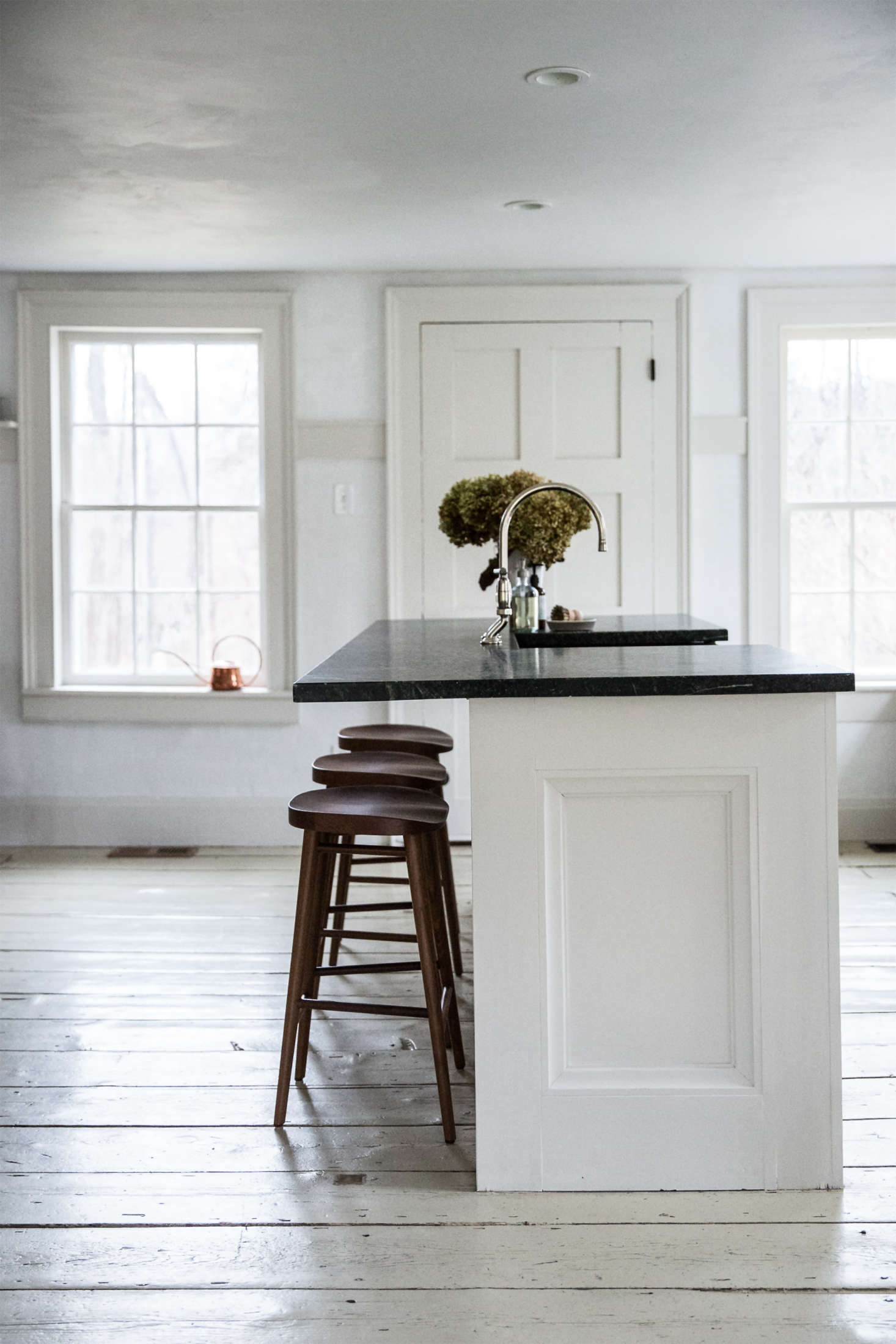 Billowy dried hydrangeas float above a soapstone kitchen sink. Photograph by Beth Kirby of Local Milk.