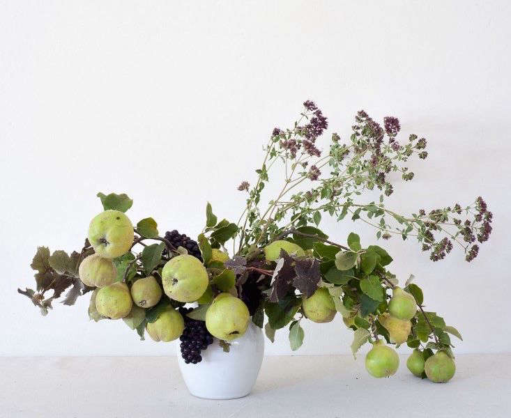 Roebuck is also a champion of enlisiting fruit in foraged arrangements. Here she uses no flowers at all, instead employing branches laden with wild apples, grapevines, and thyme to give her composition color and texture. Photograph by Matthew Williams for Gardenista, from Louesa Roebuck