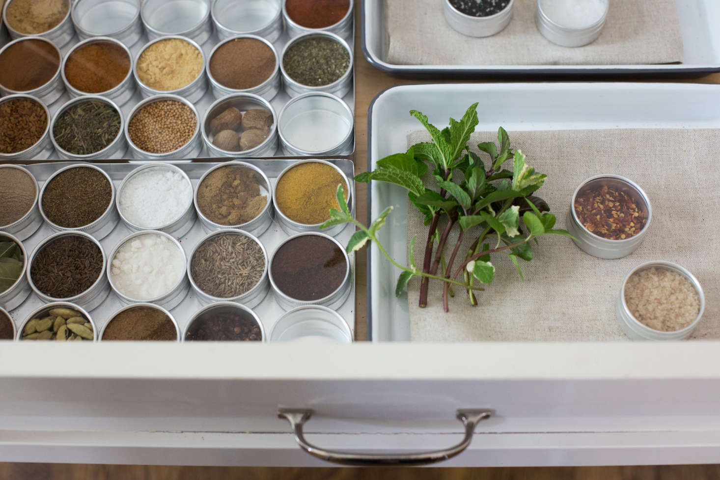 Michelle found the perfect canisters for holding her spices at a jewelry supplies store. See her clever hack in What’s Inside: A Surprising Spice Drawer Solution. Photograph by Mimi Giboin.