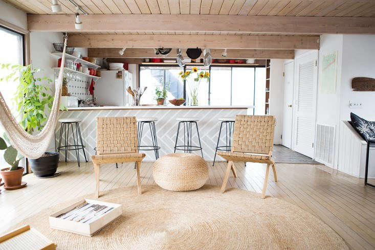 Natural fiber rugs, like this one in the houseboat home of Fredericks & Mae founders Gabe Cohen and Jolie Signorile, not only reflect the casual vibe of the coast but also they’re excellent sand traps. See Rehab Diary: The Ultimate Houseboat in NYC. Photograph by Douglas Lyle Thompson.