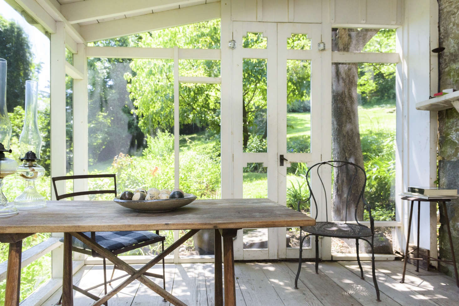 “Silence is my best friend” was one of Tomkins’s favorite sayings, says her daughter. In a screened porch, the main sounds one hears are bird calls and breezes in the trees on the property.