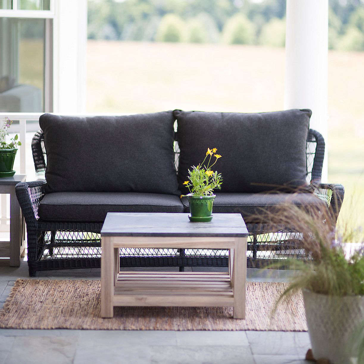 Object Of Desire: Classic Black Wicker Furniture - Gardenista A 73-inch Curved All Weather Wicker SofaCurved All Weather Wicker Sofa is 31.5 inches - Object Of Desire: Classic Black Wicker Furniture - Gardenista