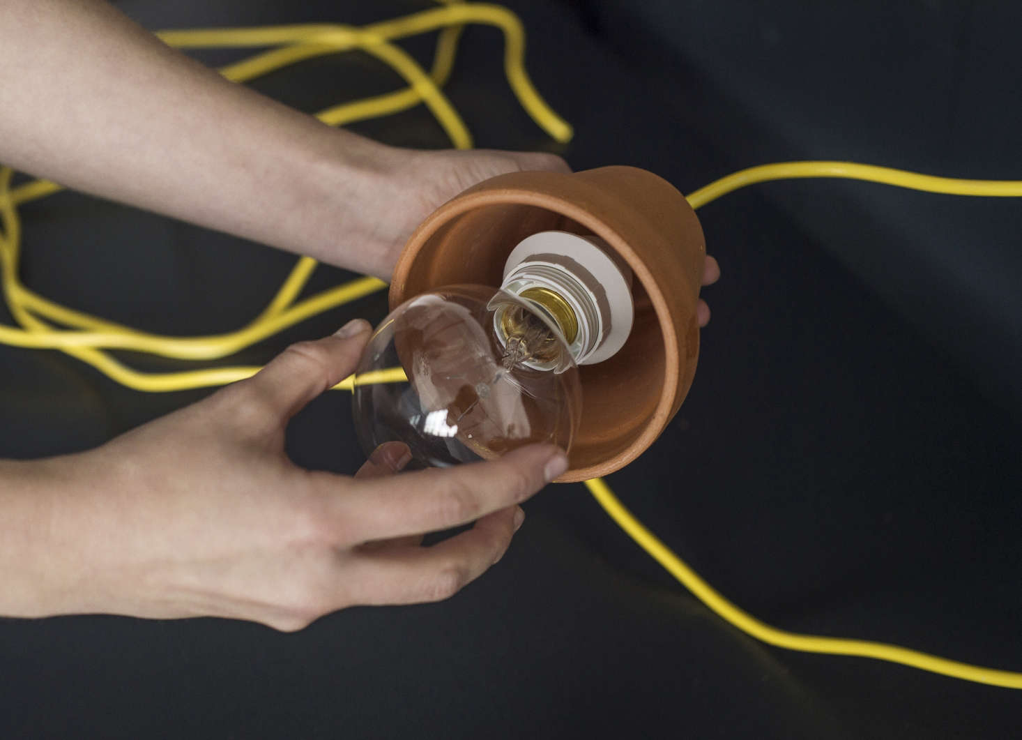 After assembling, screw in the lightbulb.
