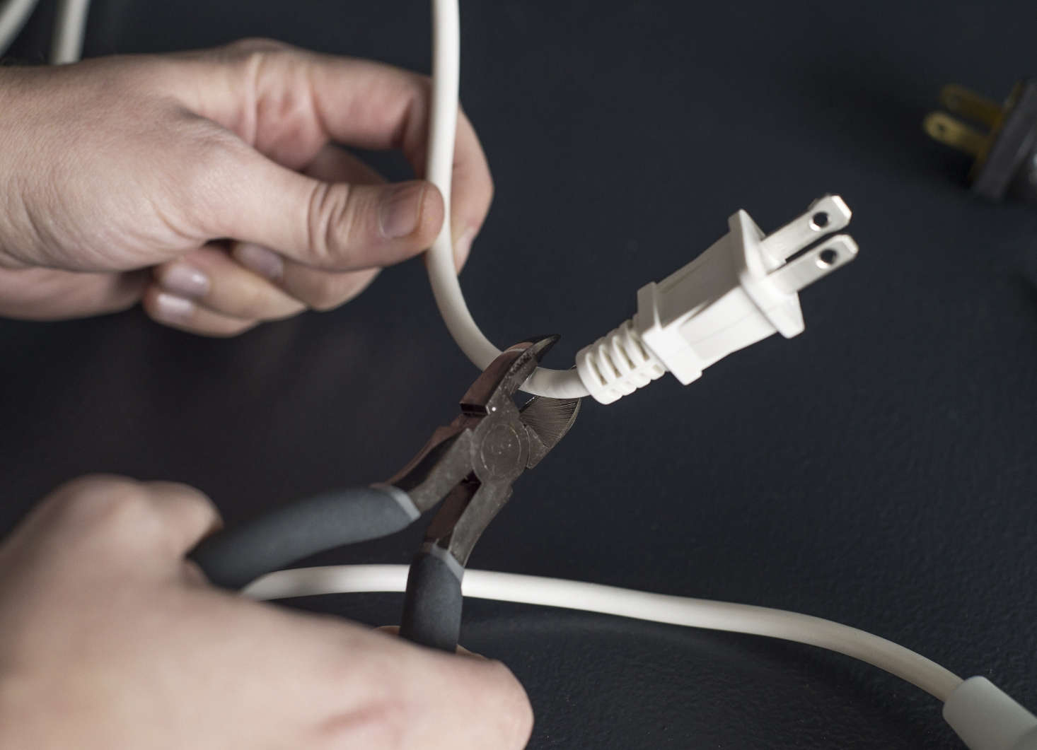Use the wire cutters to snip off the pendant cord’s plug.