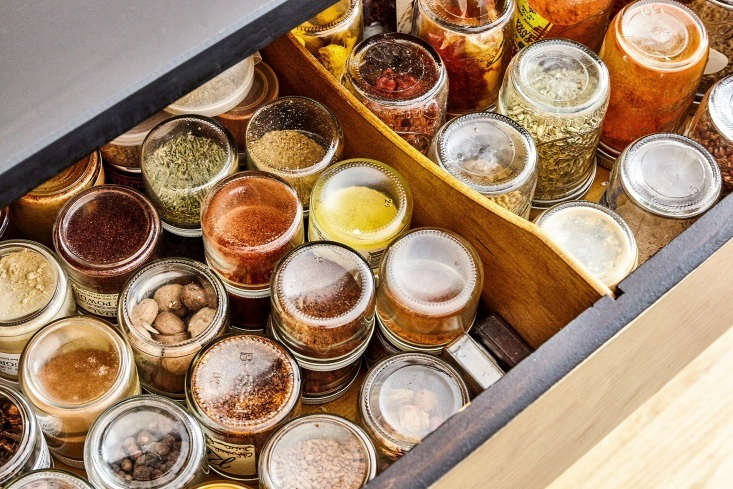 Chef David Tanis stores his spices in jars arrayed upside-down in the dresser’s top drawer. “That way I can see what I’ve got, and I don’t have to bother with labeling the jars,” he says. See more in Chef David Tanis’s Low-Tech, Economical, and Beautifully Soulful Kitchen in the East Village.