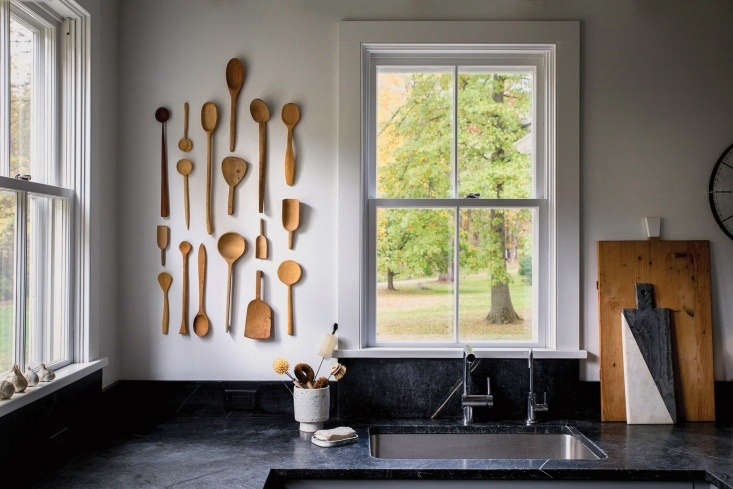 Source vintage wooden spoons on Etsy (they have a history and well-loved look) and hang them on the wall; utensil storage as art installation. See more in our Kitchen of the Week post.
