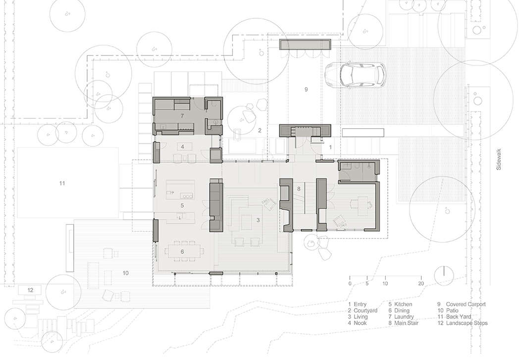 The main-level floor plan shows the driveway and carport, courtyard garden, ipe wood deck, and backyard lawn.