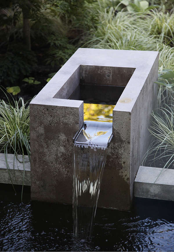 The landscape architects designed an integrated fountain of concrete and bronze for the water feature, “for its soothing sound as well as a focal point,” Wittman says. Most of the new windows are operable so that the sound of water may be heard from inside the house.