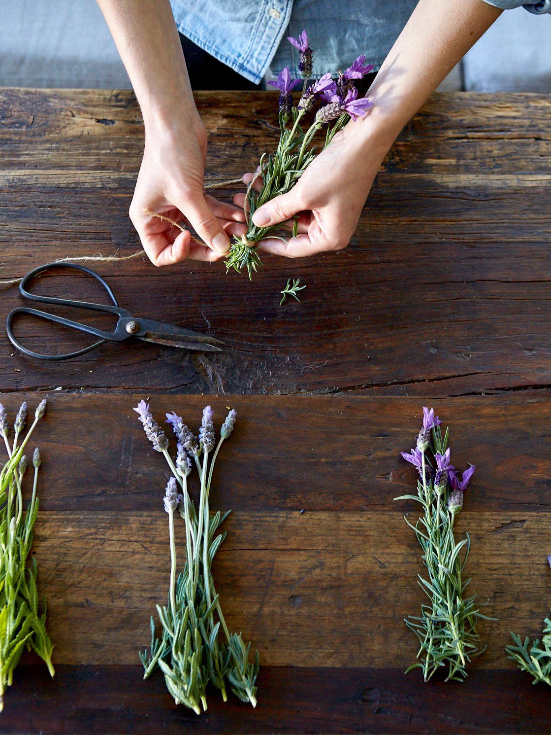 We tied some bundles at the very tips of their stems. You can experiment with tying and knotting, placing the twine where you think it looks best. This is where your personality will really shine through in the finished bundle.