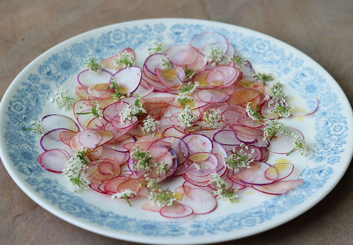 Scatter ground elder flowers across an early summer radish salad. The flowers infuse gin with their herbal fragrance, and also make a very good fresh herb salt.