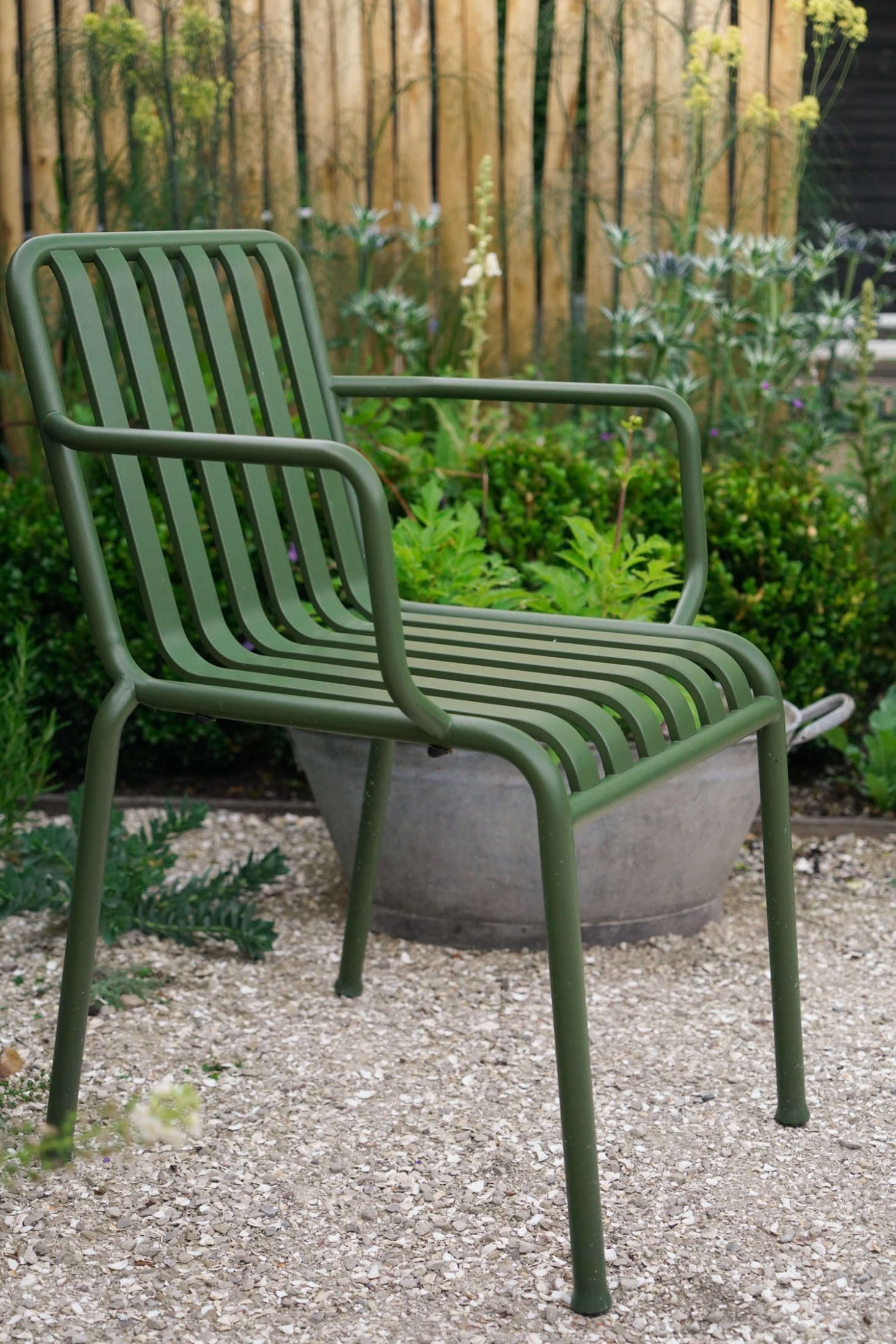 The outdoor dining table and chair are by Danish design house Hay. For more, see Outdoor Furniture: Metal Lawn Chairs Made Modern.
