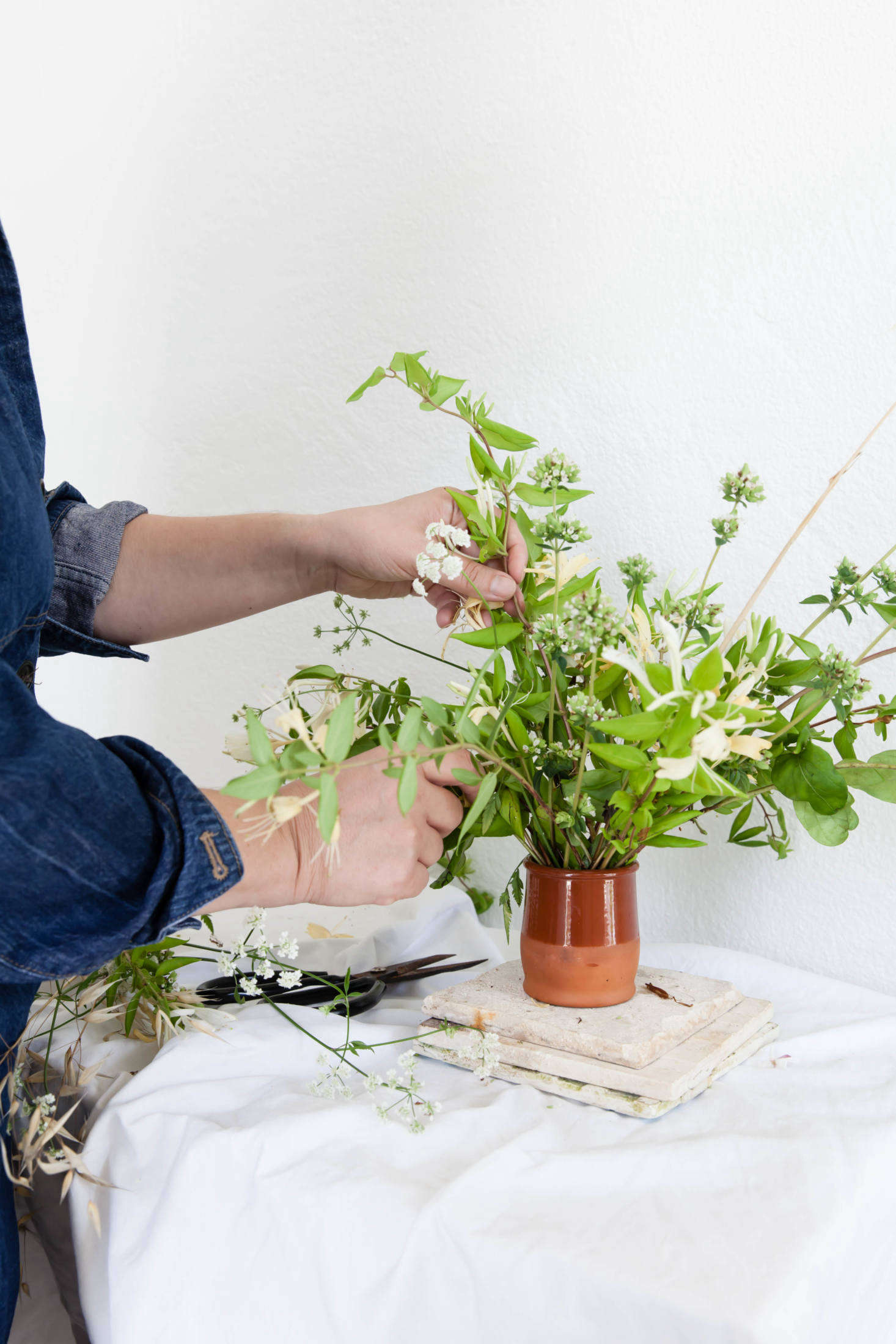 Use different tall stems of dried grasses to bring lots of height and space to the arrangement, without bringing extra weight.