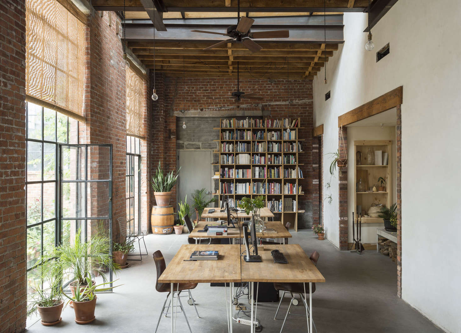 The garden spills into the indoors, where portable desks on wheels can be moved out to make room for events.