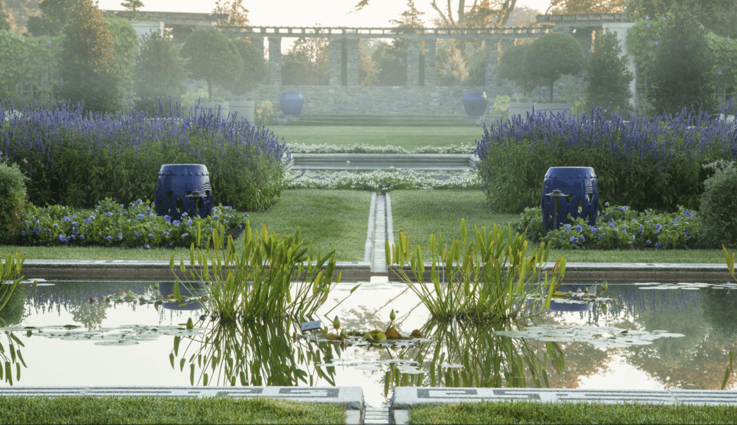Looking south past the pool, a pergola is framed by 