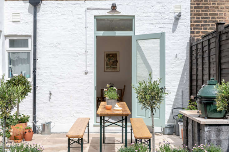 The industrial-style light fixture above the door came from a friend: “He and his partner moved to a very stylish Sixties development in Hatfield, and this didn’t quite go with their refit. We love it, though,” says Holland. Photograph courtesy of The Modern House.