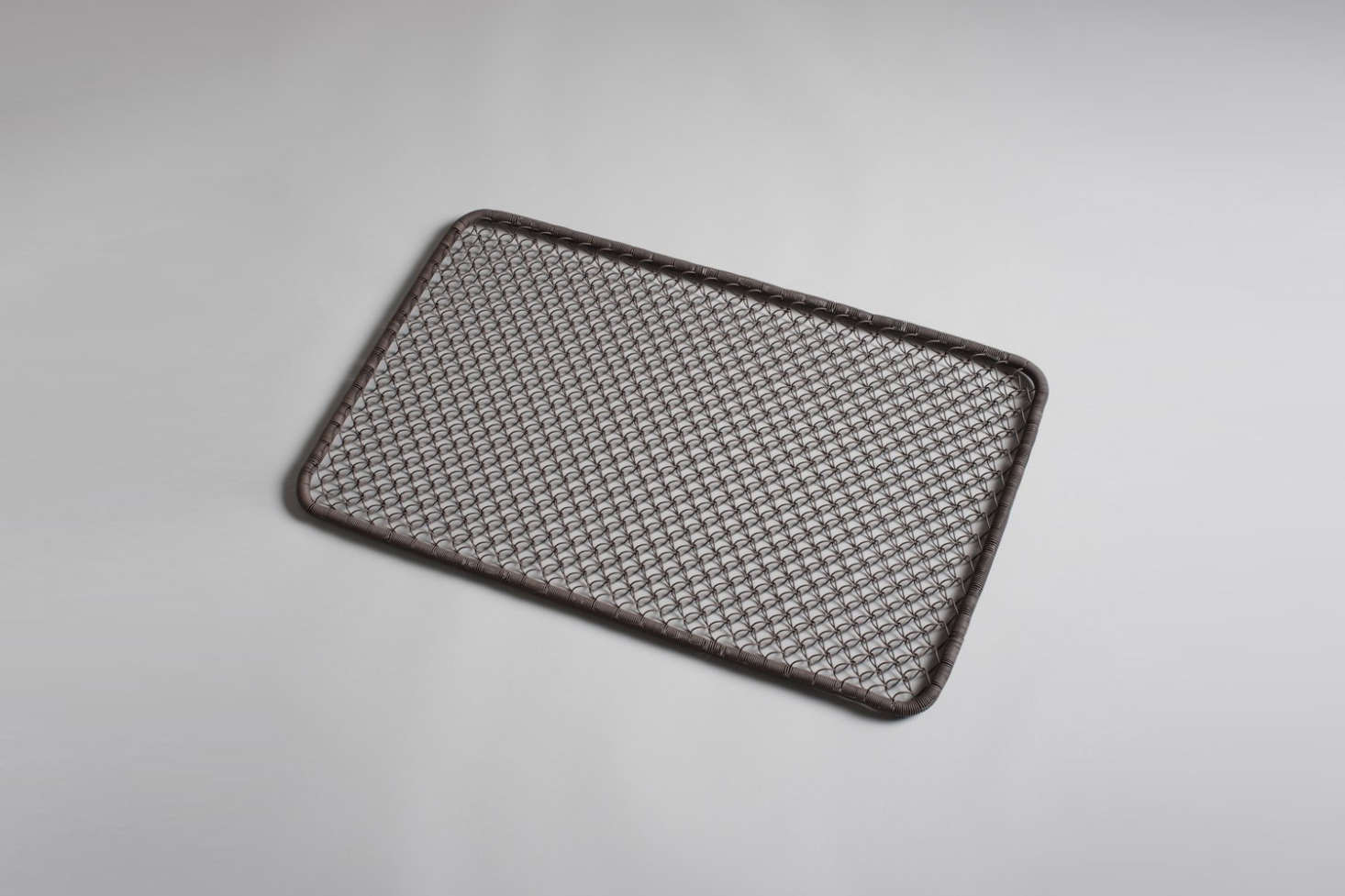 A Wire Doormat made of brown-tinted looped metal is $58 at Burkelman.