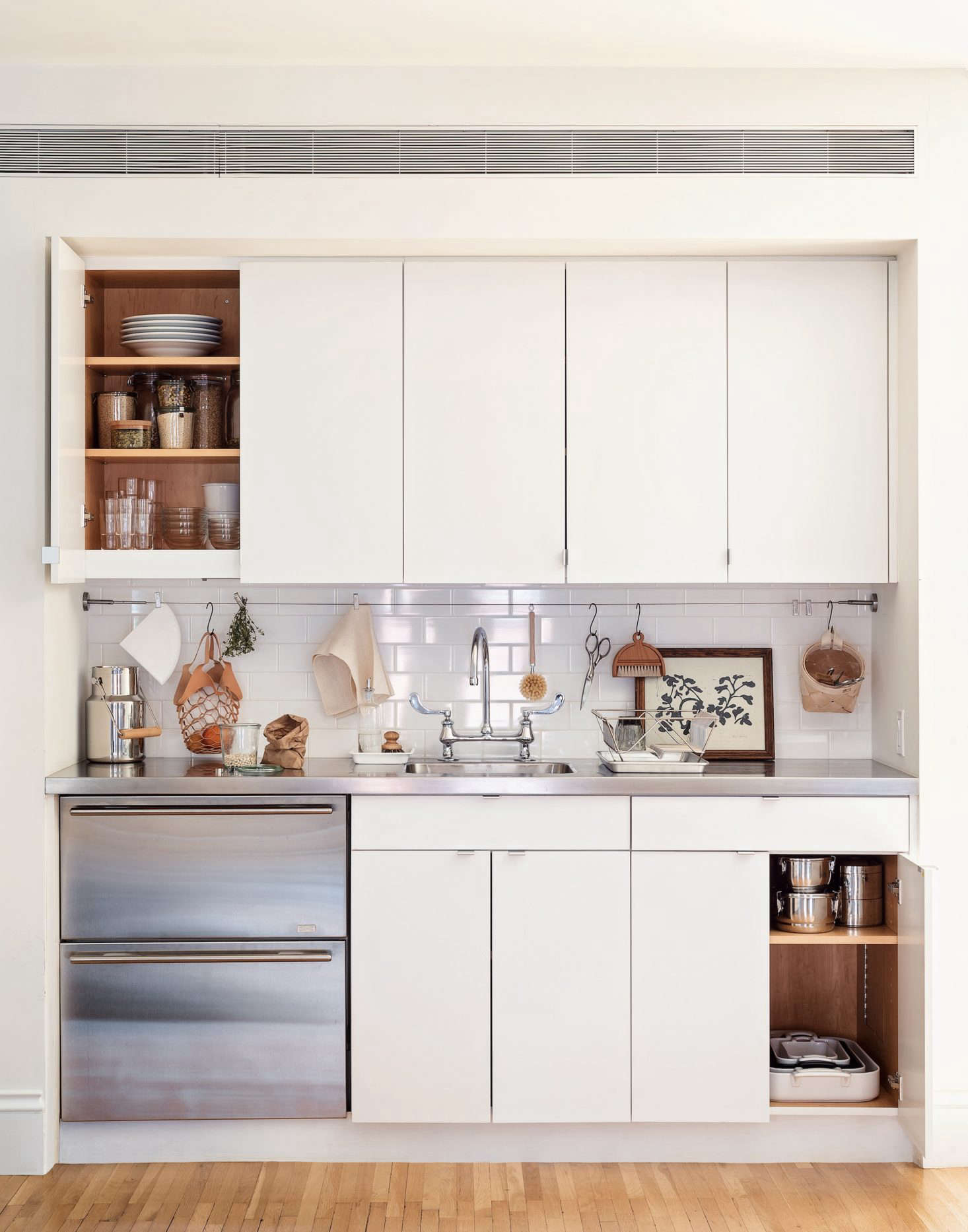Take a page from this Brooklyn kitchenette and pare down the contents of your kitchen to just the essentials. You don’t need 10 different pots and pans (in fact, you need only five), and are you ever going to use that Spiralizer? Photograph by Matthew Robbins from Remodelista: The Organized Home. See 5 Space-Saving Ideas to Steal from a Brooklyn Kitchenette, Ikea Hack Included.